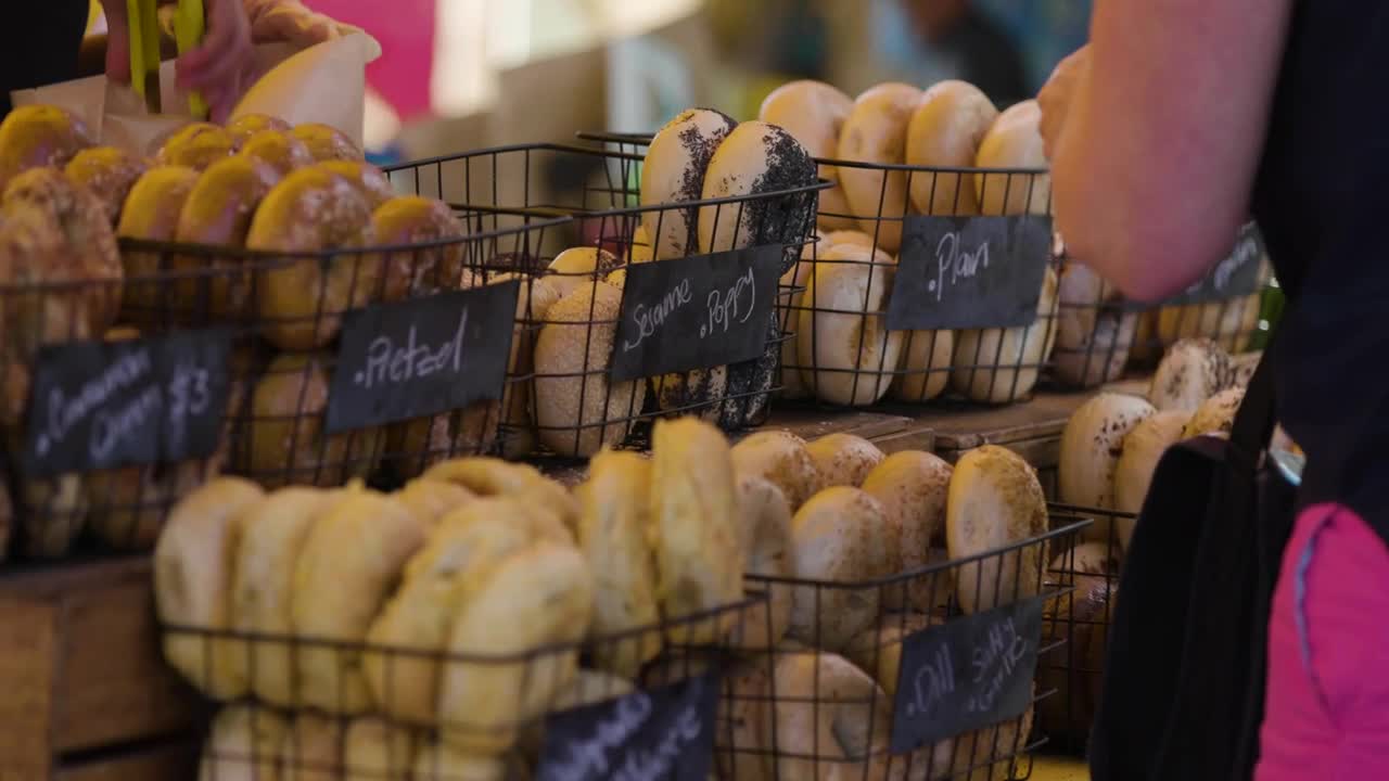 Stock Video People Buying Bagels At A Market Live Wallpaper