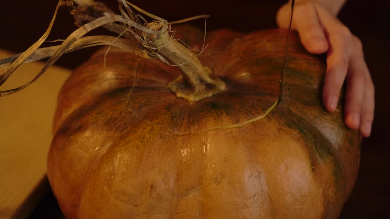Stock Video Person Making A Hole In A Pumpkin For Halloween Live Wallpaper
