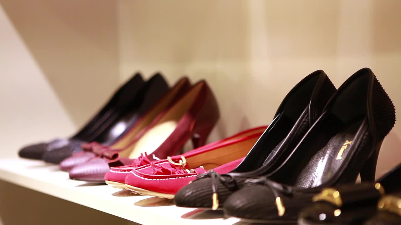 Video Stock Person Reviewing Stand Shoes In A Store Live Wallpaper Free