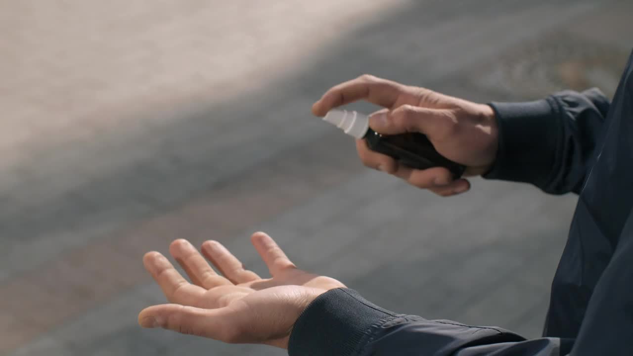 Video Stock Person Sanitizing His Hands With A Spray Live Wallpaper Free