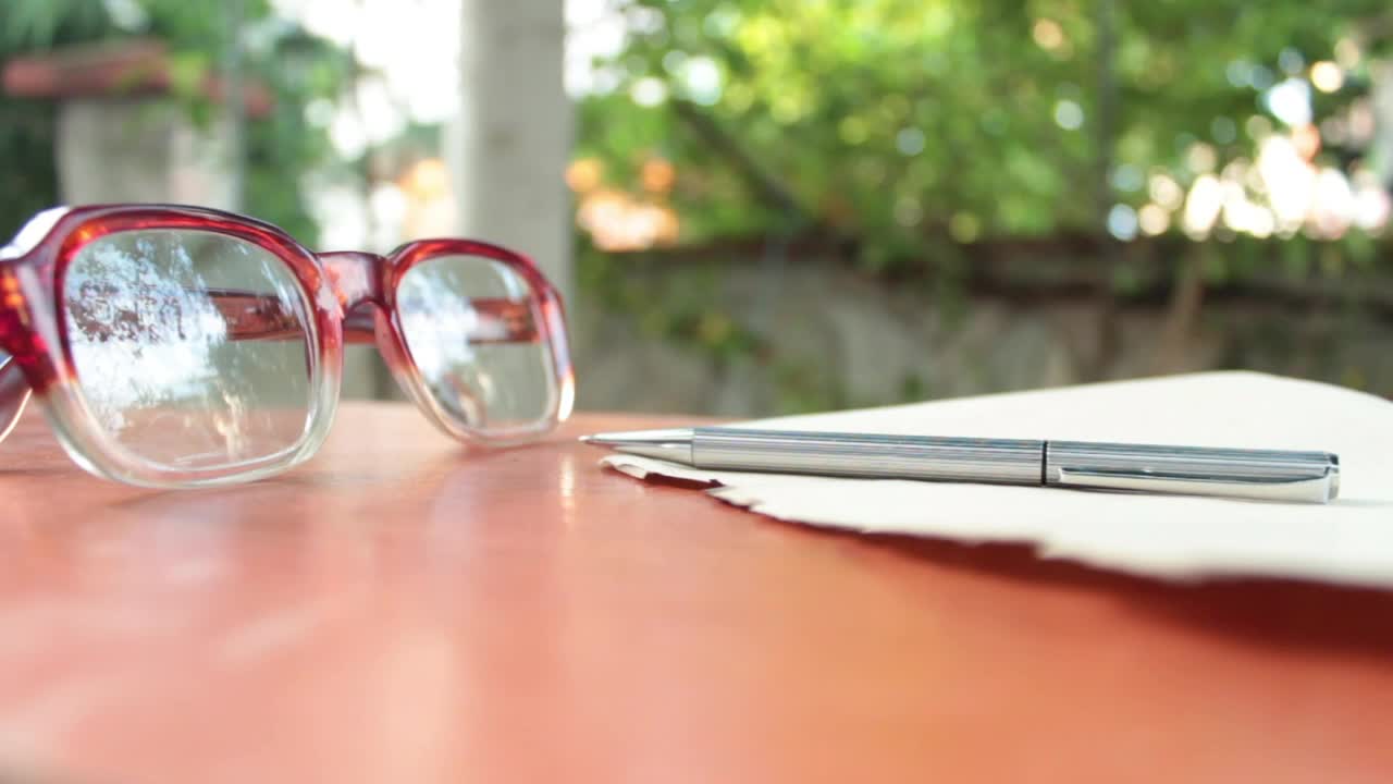 Video Stock Person Takes His Glasses And Write On A Sheet Live Wallpaper Free