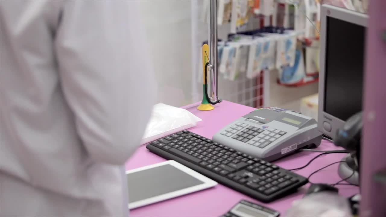 Video Stock Pharmacy Worker Accepts Payment At Checkout Live Wallpaper Free