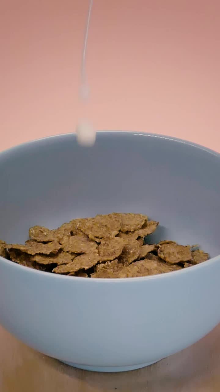 Video Stock Pouring Milk Into A Bowl With Healthy Cereal Live Wallpaper Free