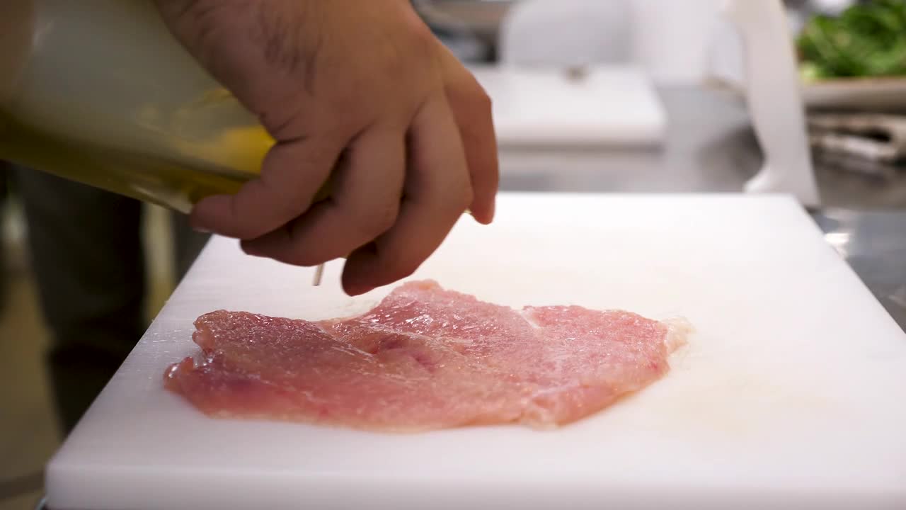 Video Stock Pouring Oil Over A Flat Chicken Steak Live Wallpaper Free