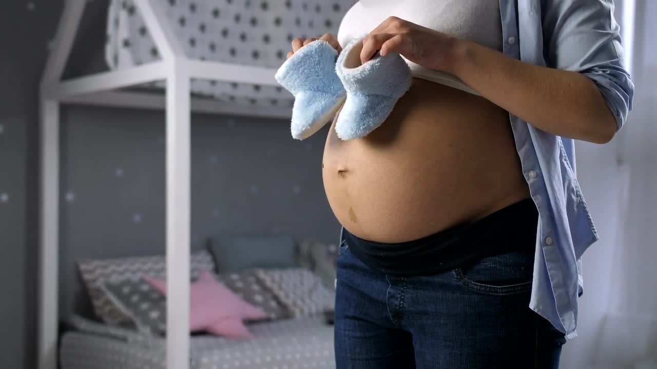 Video Stock Pregnant Woman With Baby Shoes Live Wallpaper Free