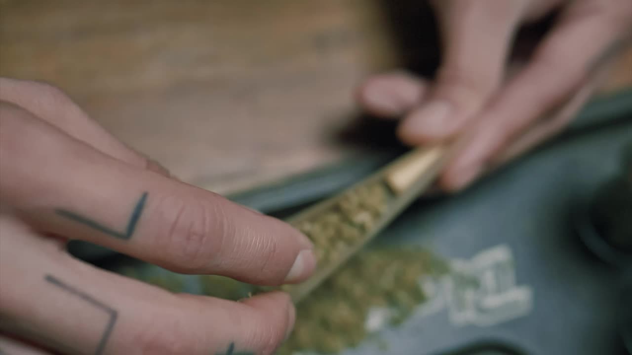 Video Stock Preparing A Marijuana Cigarette Live Wallpaper Free