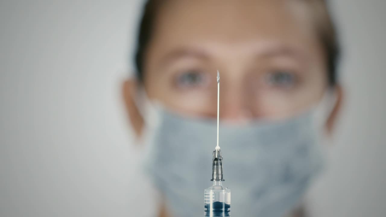 Video Stock Preparing A Vaccine Syringe Live Wallpaper Free