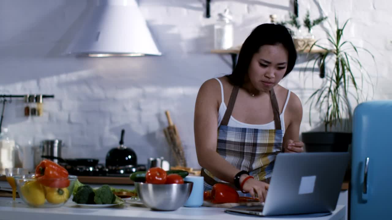 Video Stock Preparing Food Following A Tutorial In The Kitchen Live Wallpaper Free