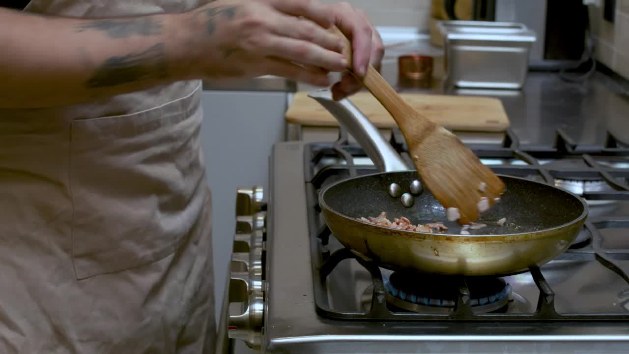 Video Stock Professional Cook Frying Bacon In A Frying Pan Live Wallpaper Free