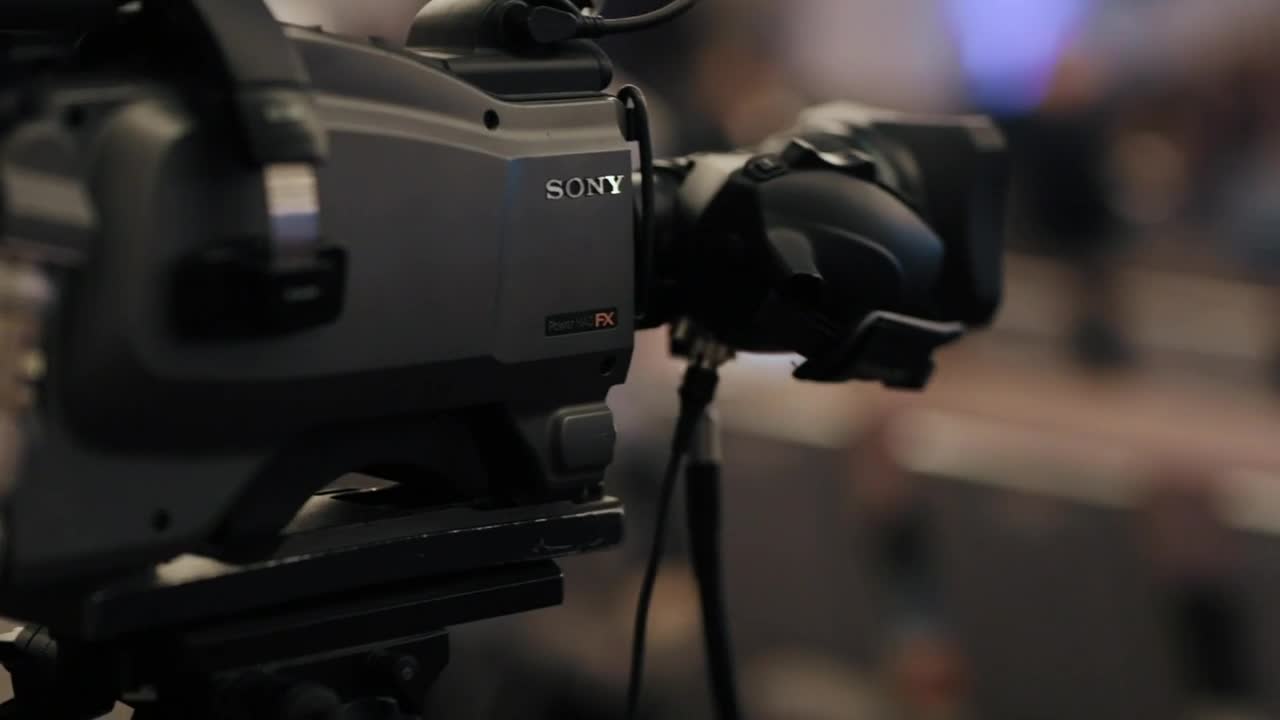 Video Stock Professional Video Camera On A Tripod Recording A Talk Live Wallpaper Free