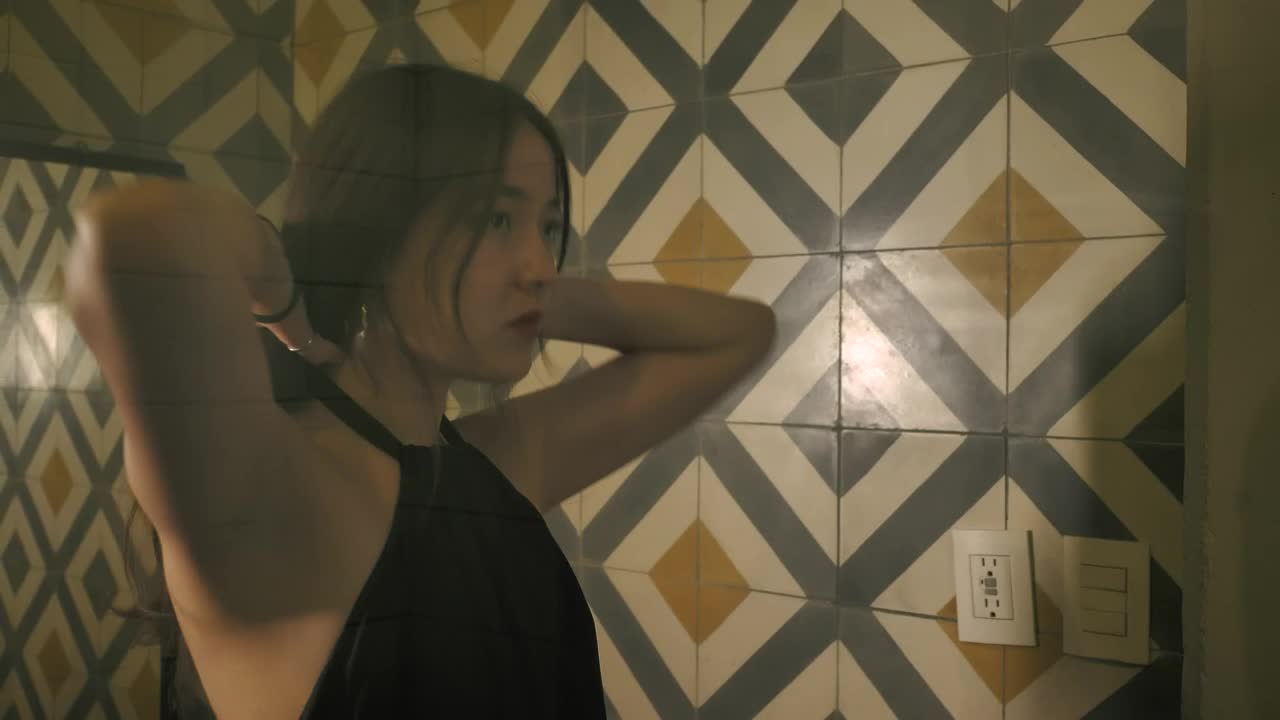 Free Stock Video Reflection In A Womans Mirror As She Ties Her Hair Live Wallpaper