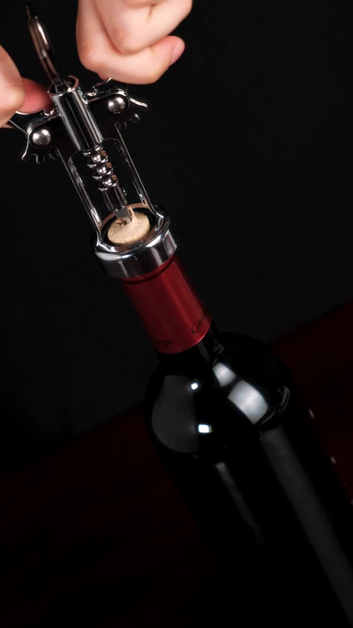 Free Stock Video Removing The Cork From A Wine Bottle With A Corkscrew Live Wallpaper
