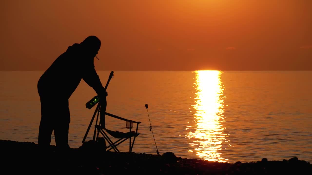 Free Stock Video Silhouette Of A Man Preparing Chair To Fish Live Wallpaper