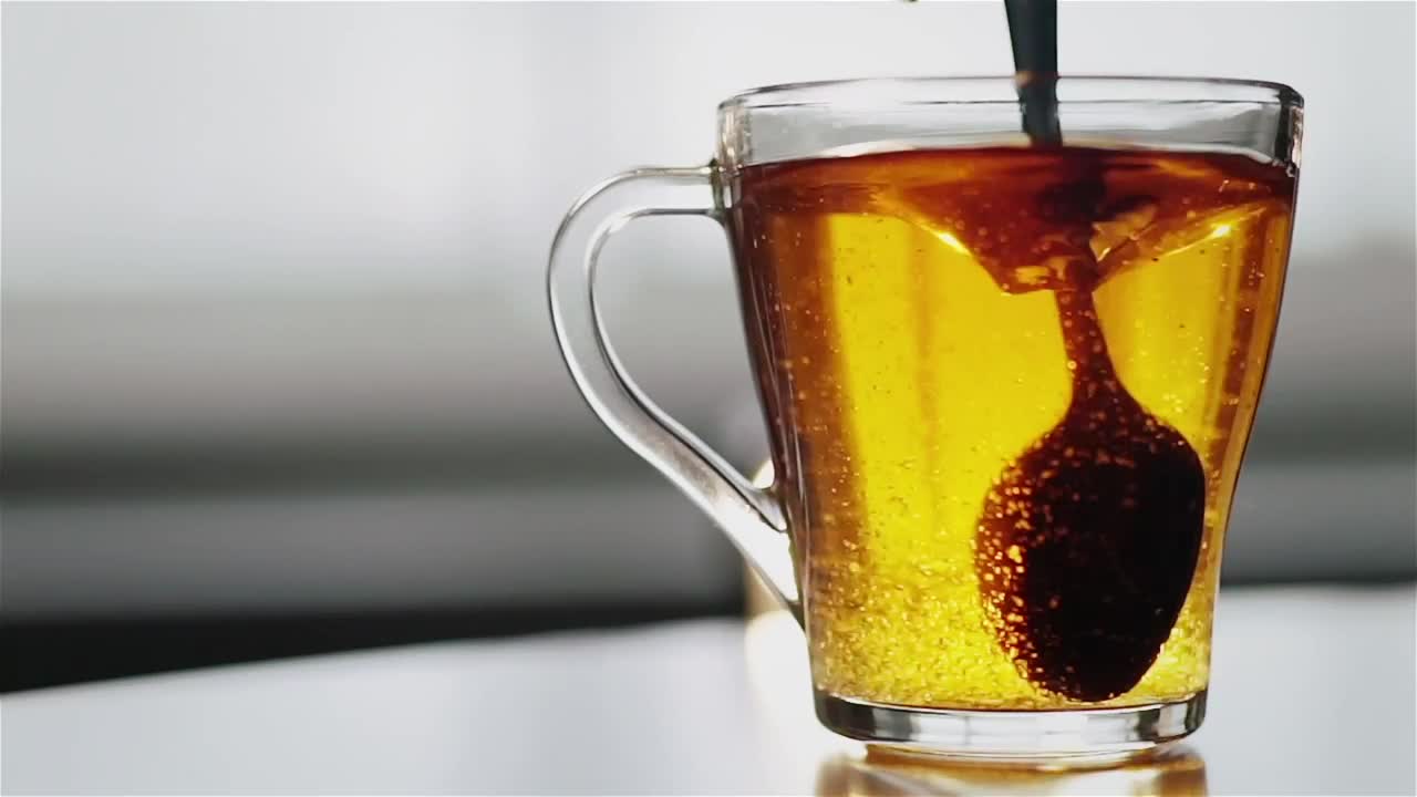 Free Video Stock Spoon Stirring Sugar In Clear Glass Tea Cup Live Wallpaper