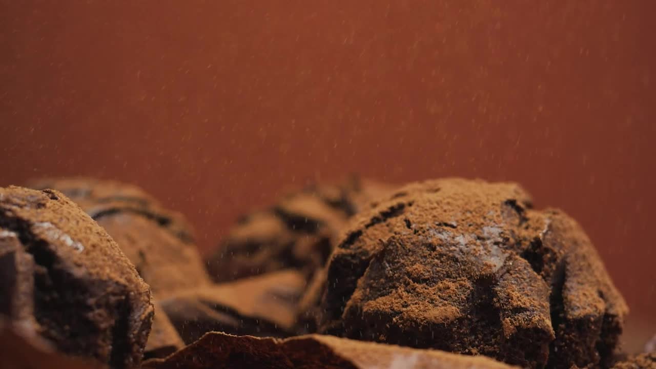 Free Video Stock Spread Chocolate Powder Over Chocolate Cupcakes Live Wallpaper