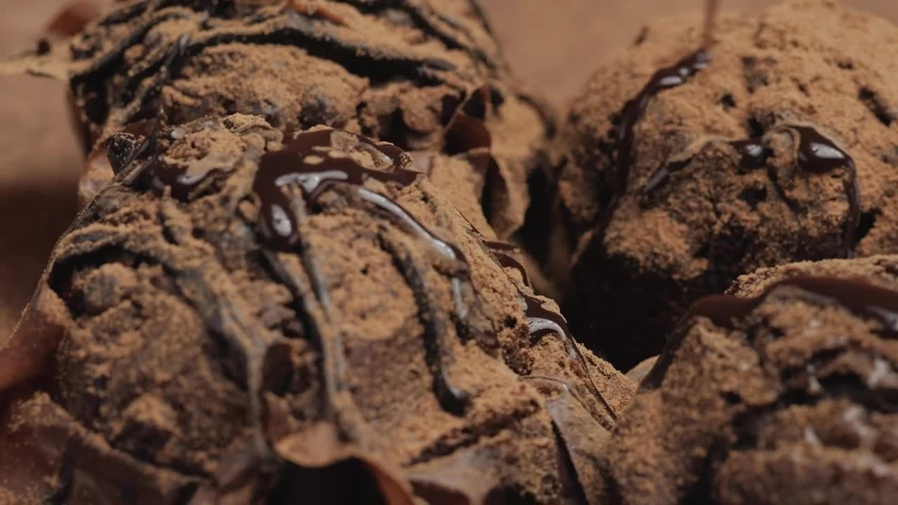 Free Video Stock Spread Chocolate Syrup On Some Chocolate Cupcakes Live Wallpaper