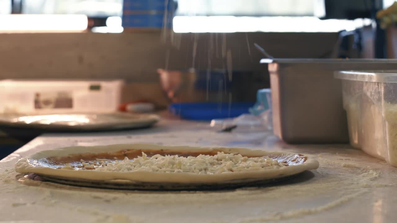Free Video Stock Spreading Cheese On A Pizza Live Wallpaper