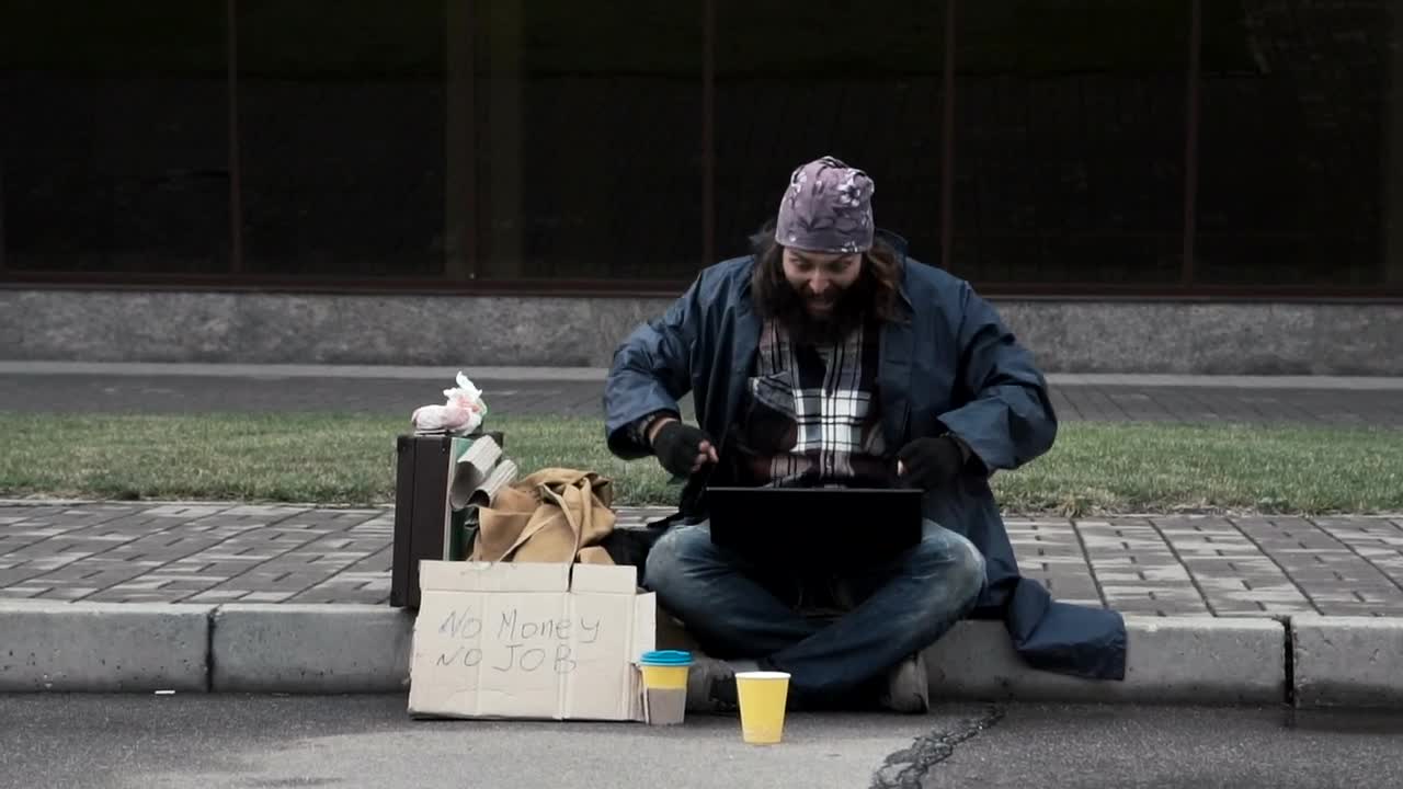 Free Video Stock super excited homeless man with a laptop Live Wallpaper