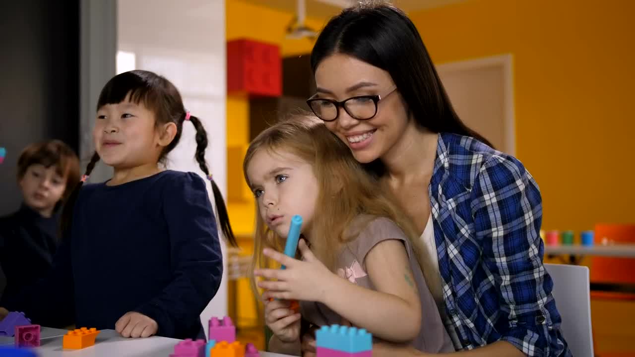 Free Video Stock teacher guiding her students Live Wallpaper