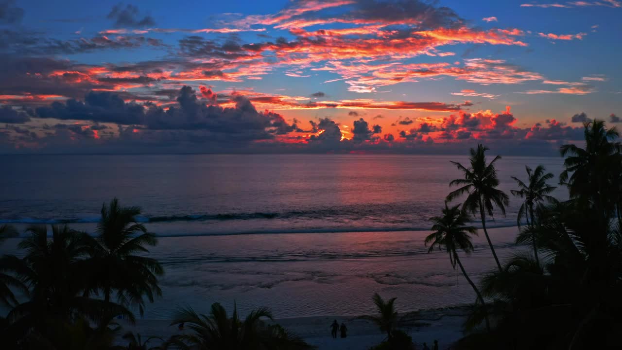 Free Video Stock the beach at sunset in the background Live Wallpaper