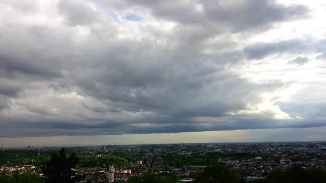 Free Video Stock thick clouds over a large city Live Wallpaper
