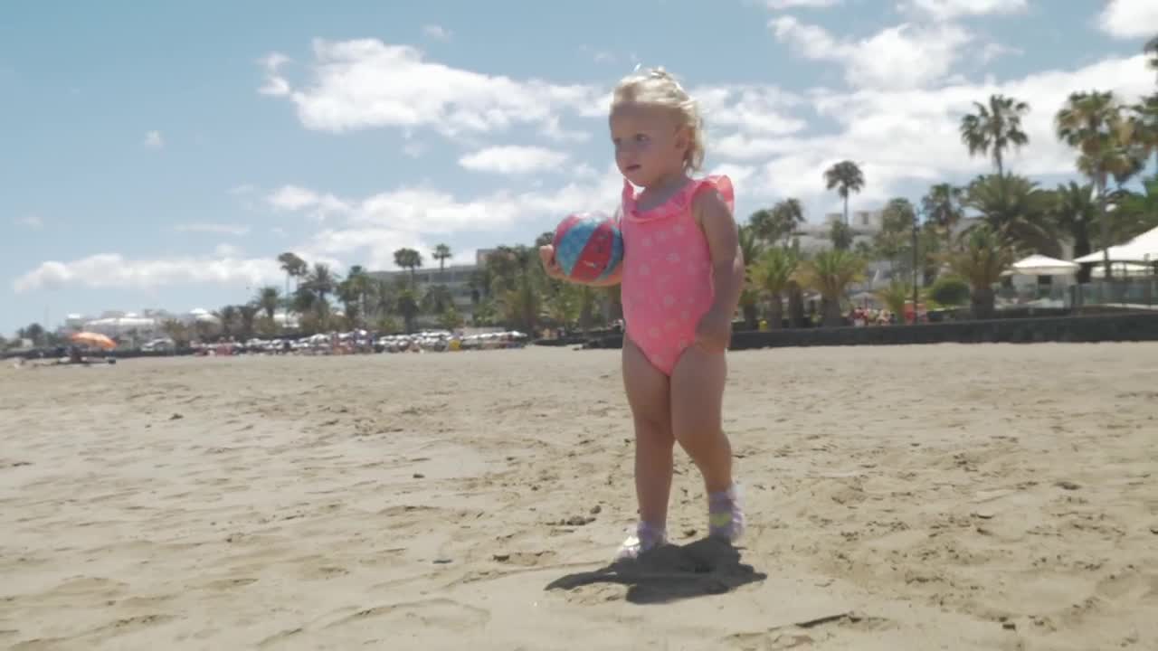 Free Video Stock toddler holding a small ball Live Wallpaper