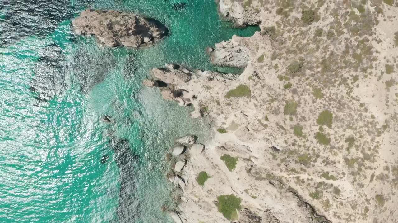 Free Video Stock top shot of the seashore with crystal clear water Live Wallpaper