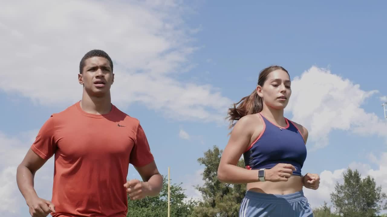 Free Stock Video Two People Running Outdoors On A Sunny Day Live Wallpaper