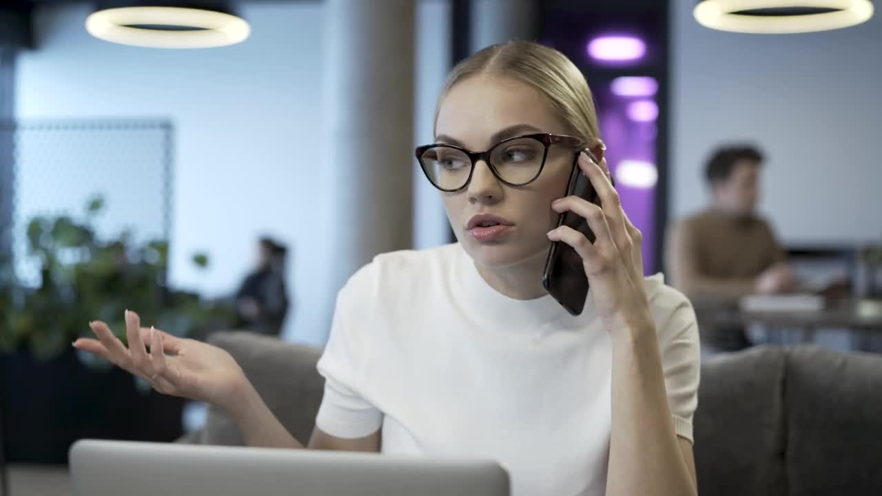 Free Stock Video Young Woman With Glasses Talking On The Phone Live Wallpaper