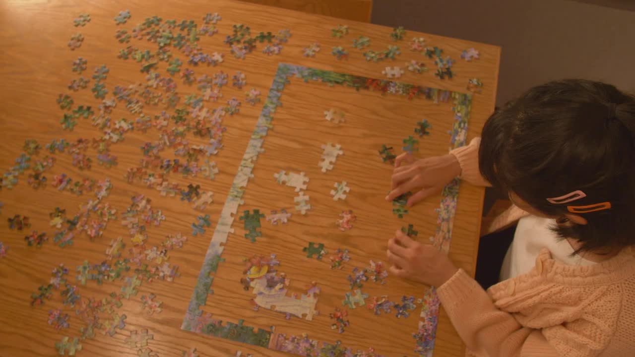 Free Stock Video Young Woman Putting Together A Puzzle Live Wallpaper