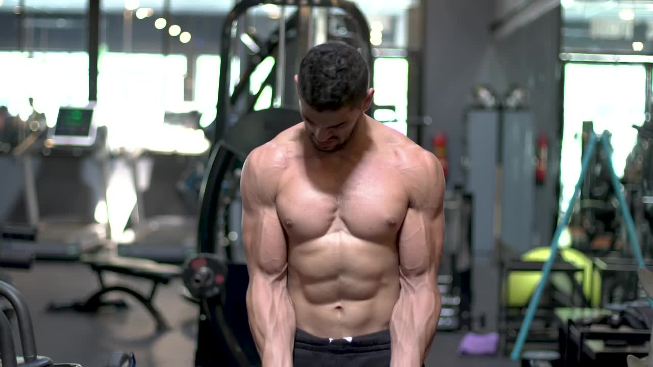Free Stock Video Young Man Working Out With A Dumbbell In A Gym Live Wallpaper