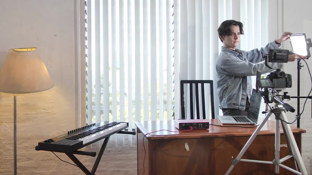 Free Stock Video Young Man Preparing A Film Set In An Office Live Wallpaper