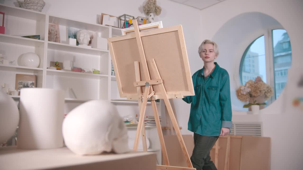 Free Stock Video Young Artist Painting A Skull On Canvas Live Wallpaper