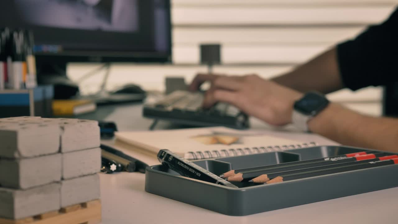 Free Stock Video Working On A Computer Surrounded By Artifacts For Drawing Live Wallpaper