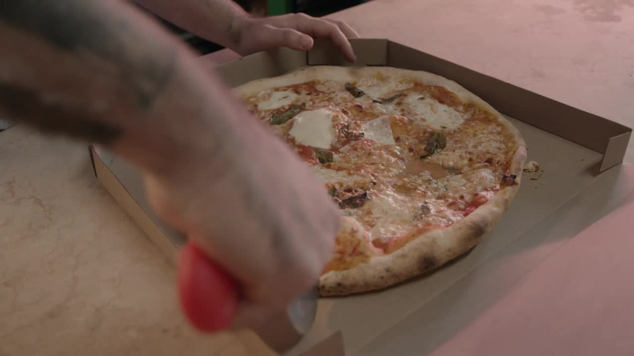 Free Stock Video Worker Of A Pizzeria Cutting A Pizza Live Wallpaper
