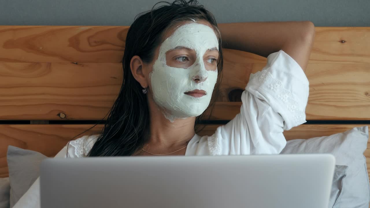 Free Stock Video Woman With Beauty Facial Mask Lying In Bed Live Wallpaper