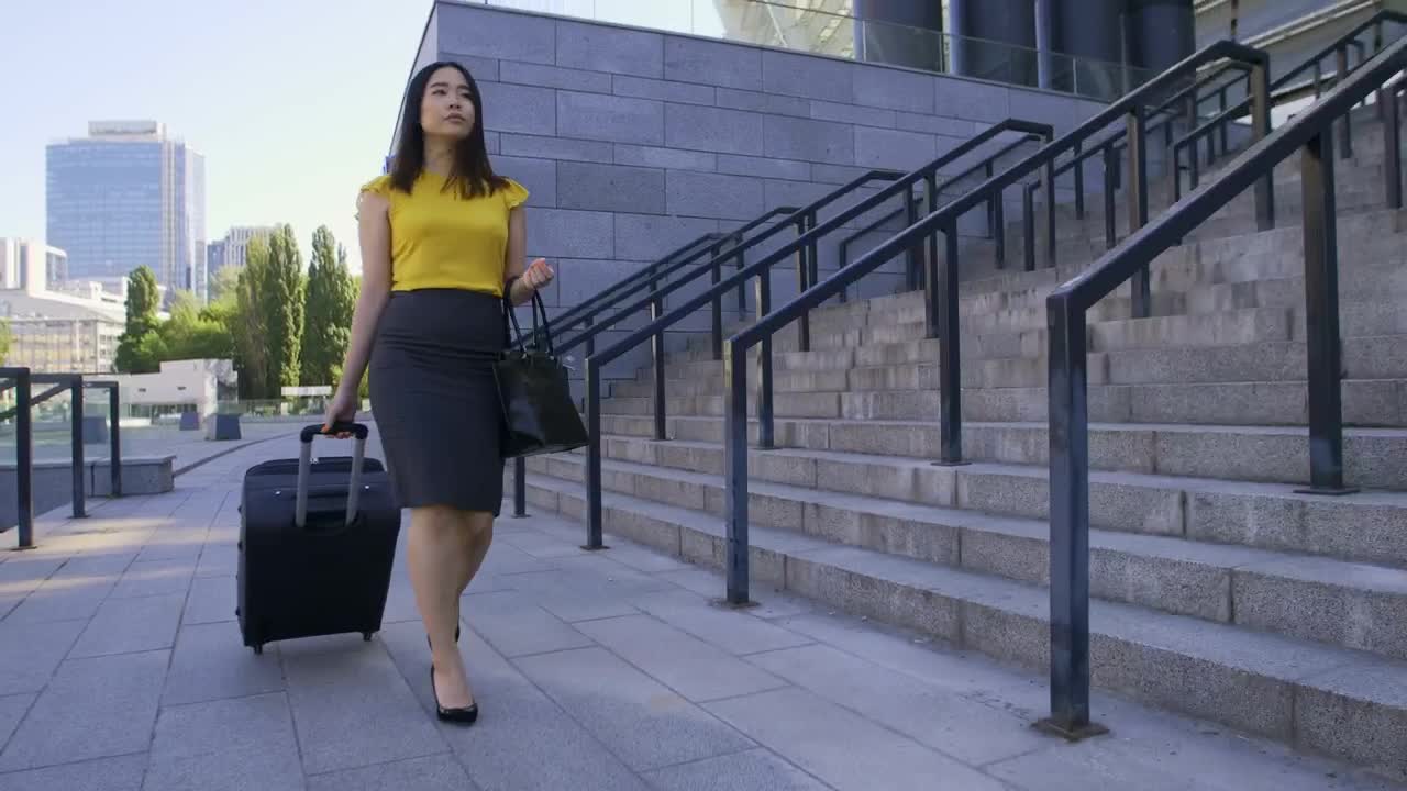 Free Stock Video Woman Walking Down The Street With A Travel Suitcase Live Wallpaper