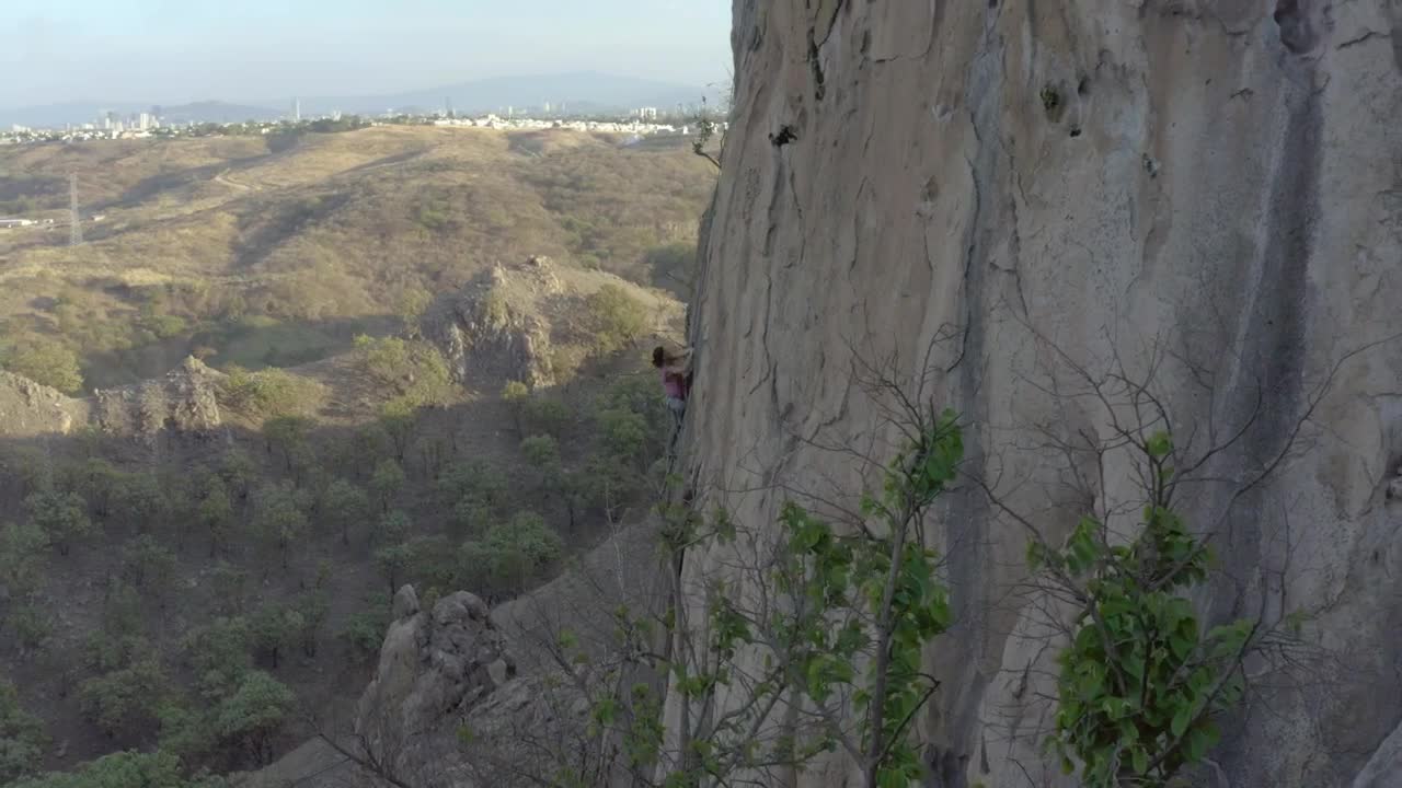 Free Stock Video Woman Climbing A Vertical Rocky Of A Large Mountain Live Wallpaper