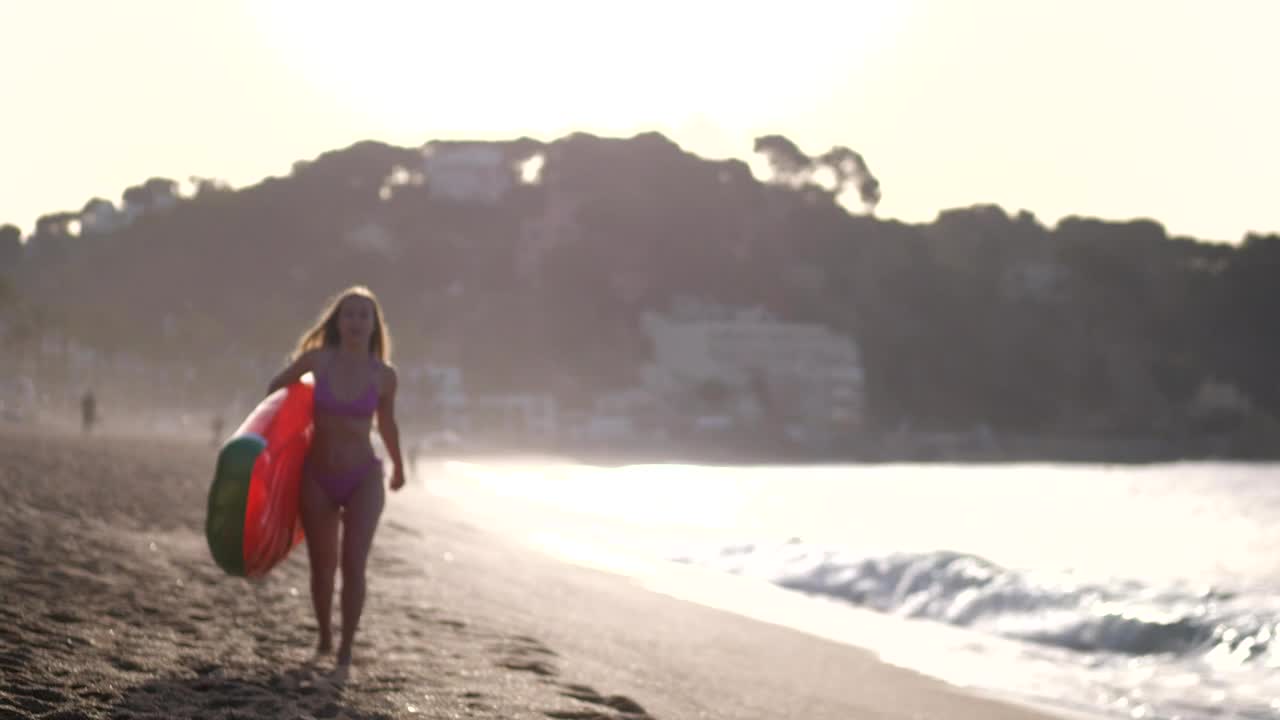   Stock Footage Woman Carrying A Beach Inflatable Live Wallpaper