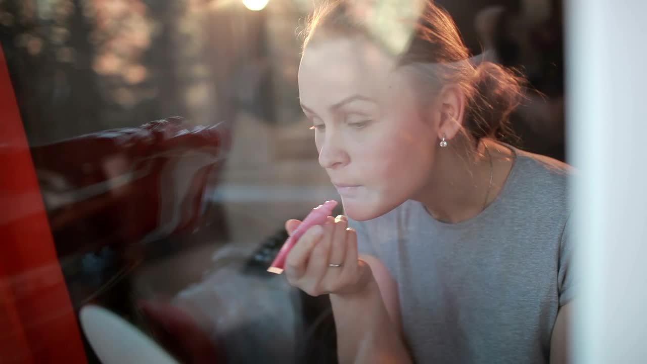   Stock Footage Woman Applying Pink Lip Gloss Live Wallpaper