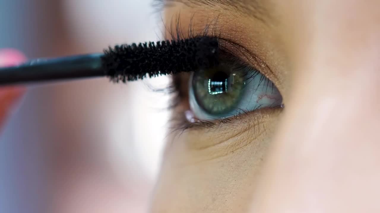   Stock Footage Woman Applying Mascara In Her Eyes Live Wallpaper
