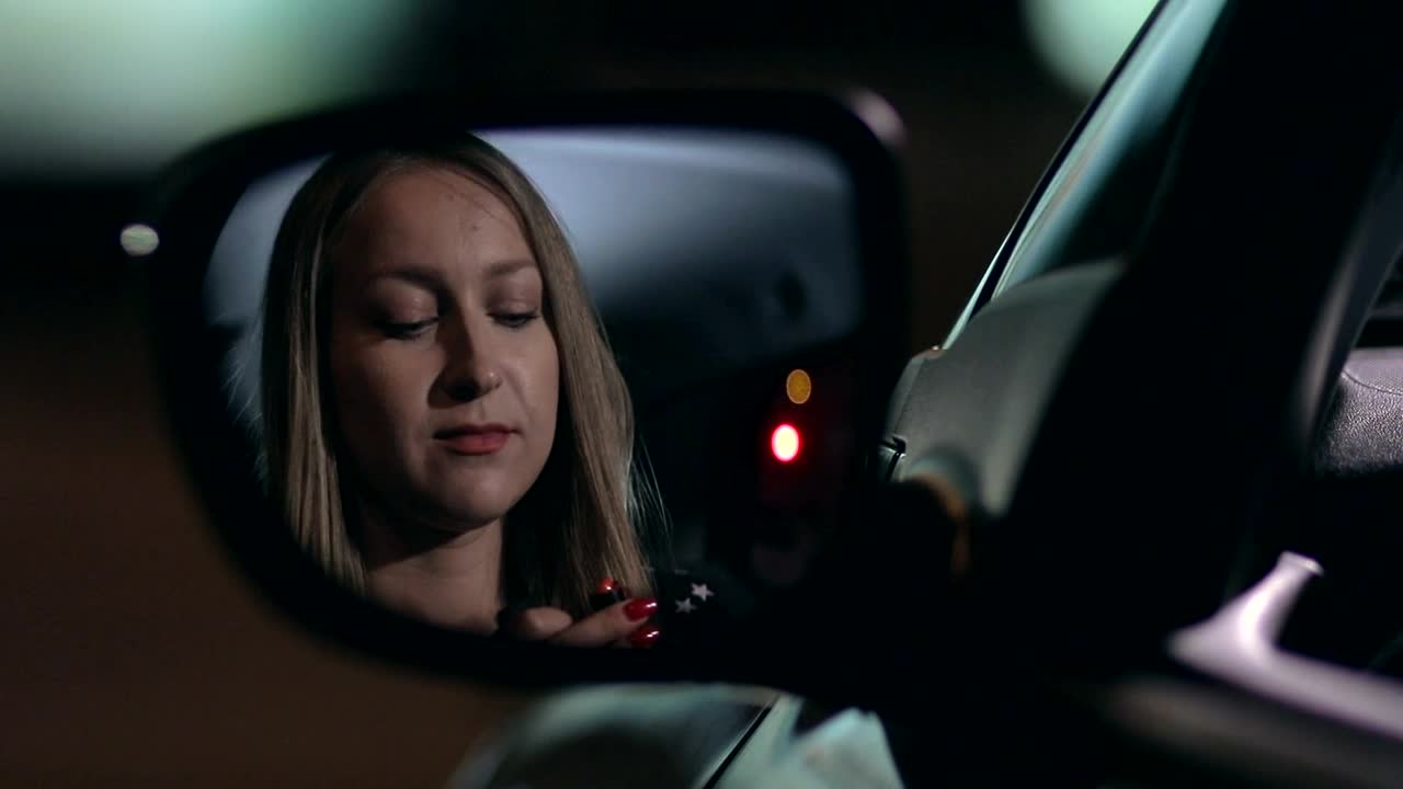   Stock Footage Woman Applying Lipstick In A Car Live Wallpaper