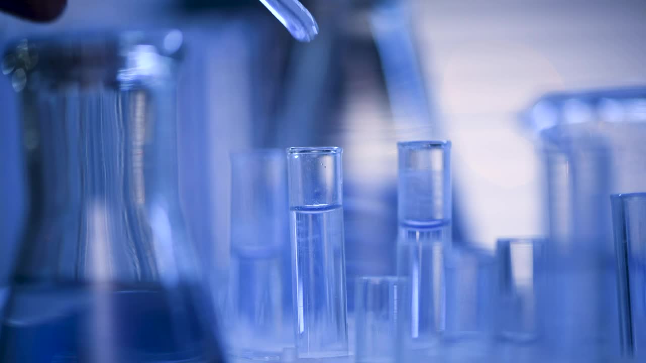   Stock Footage Water Dropper And Lab Tubes Live Wallpaper