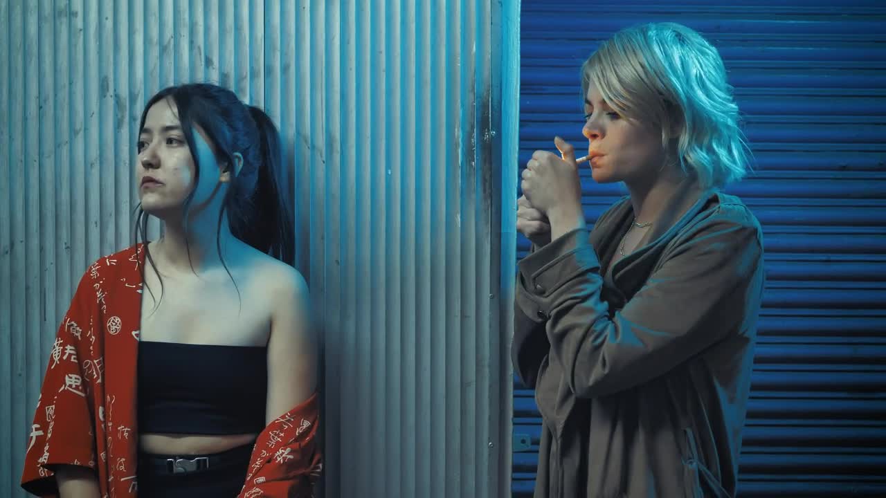   Stock Footage Urban Woman Shares Her Cigarette With Her Friend Live Wallpaper