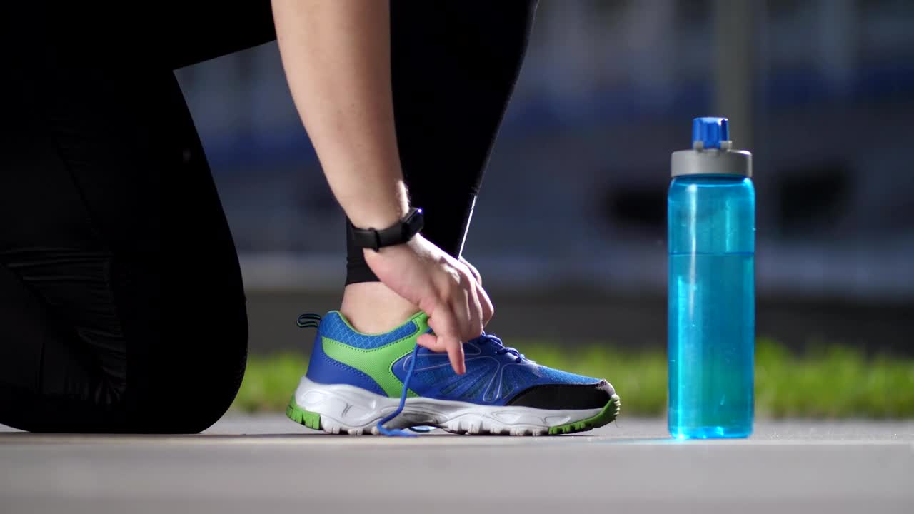   Stock Footage Typing Her Shoes Before Exercising Live Wallpaper