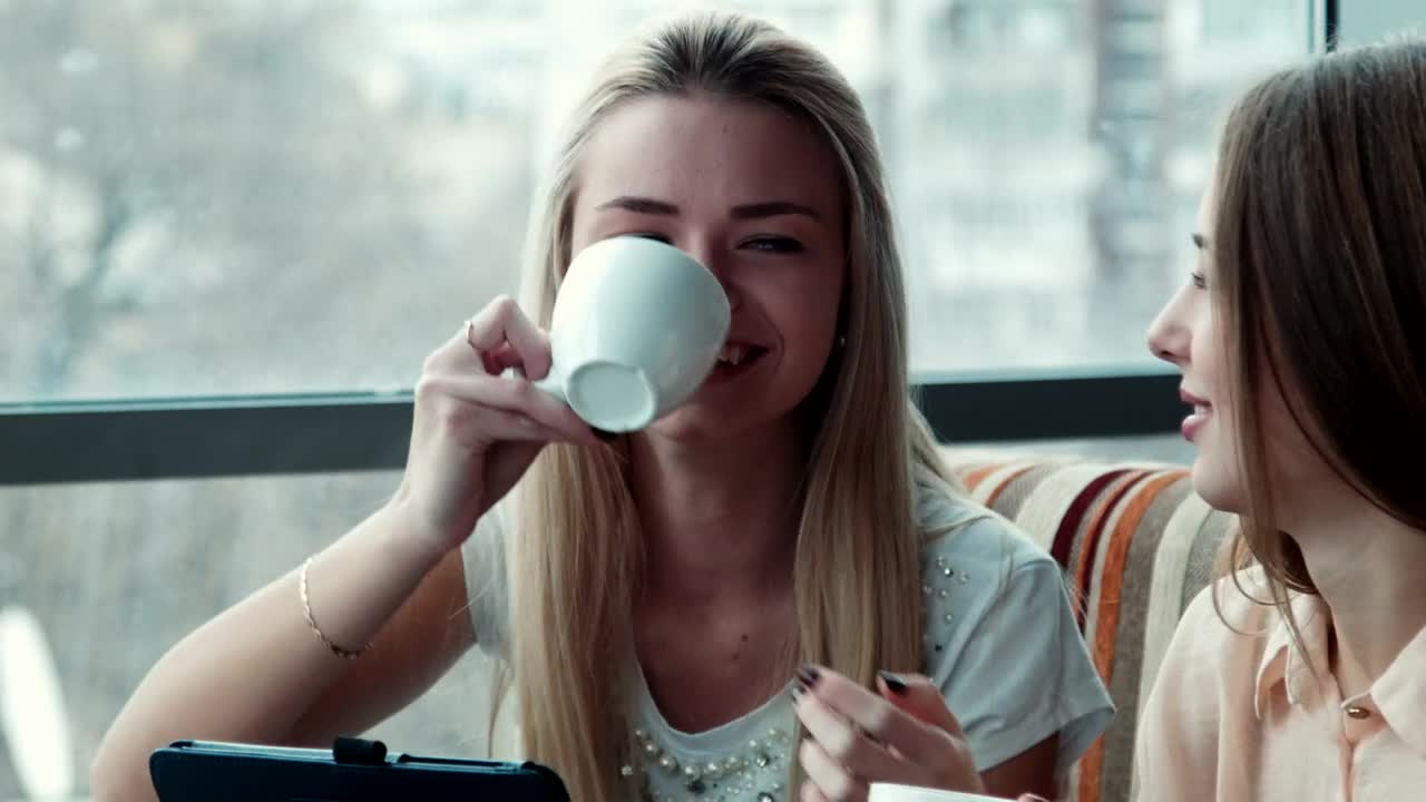   Stock Footage Two Young Woman Laughing In The Coffee Shop Live Wallpaper