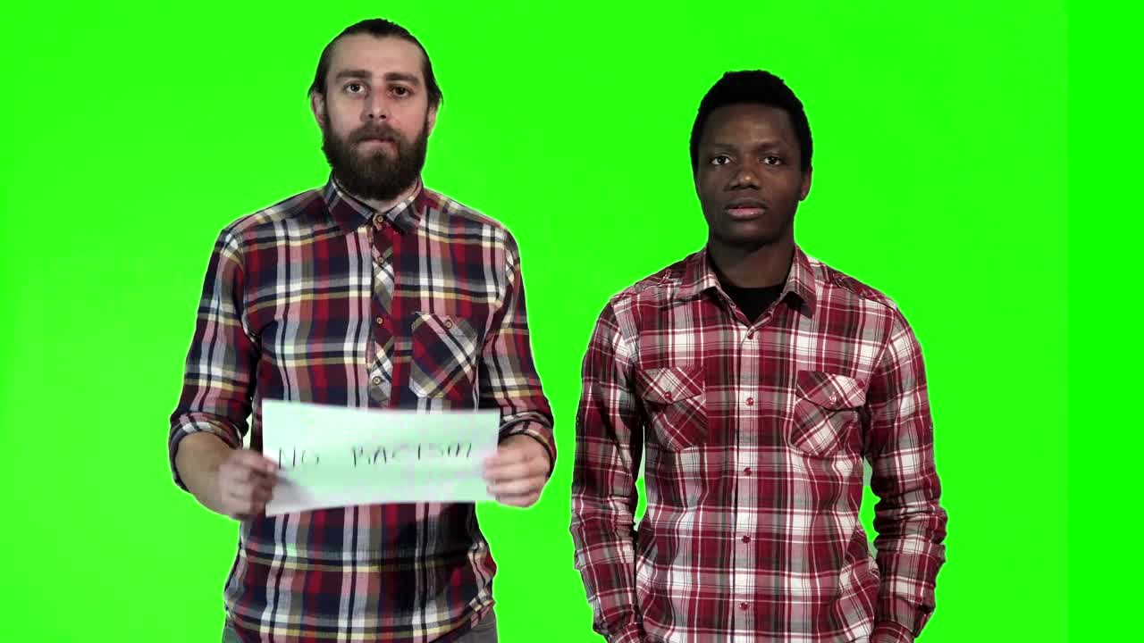   Stock Footage Two Men Holding Up A No Racism Sign Live Wallpaper