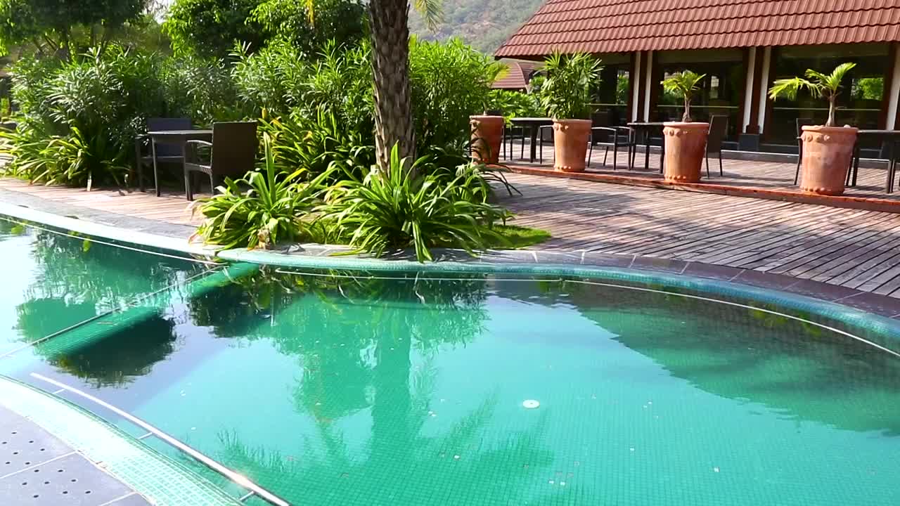   Stock Footage Turquoise Swimming Pool In The Hotel Patio Live Wallpaper