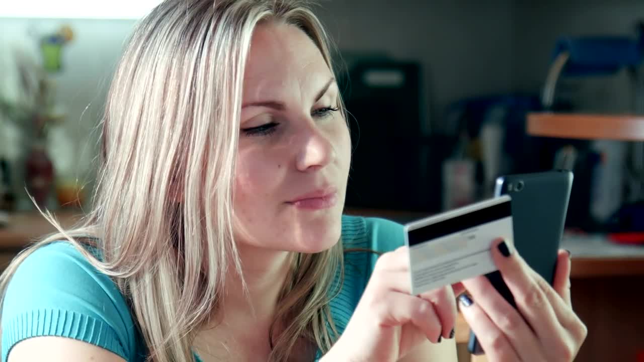 Stock Footage Young Woman Using The Phone With Credit Card Live Wallpaper Free