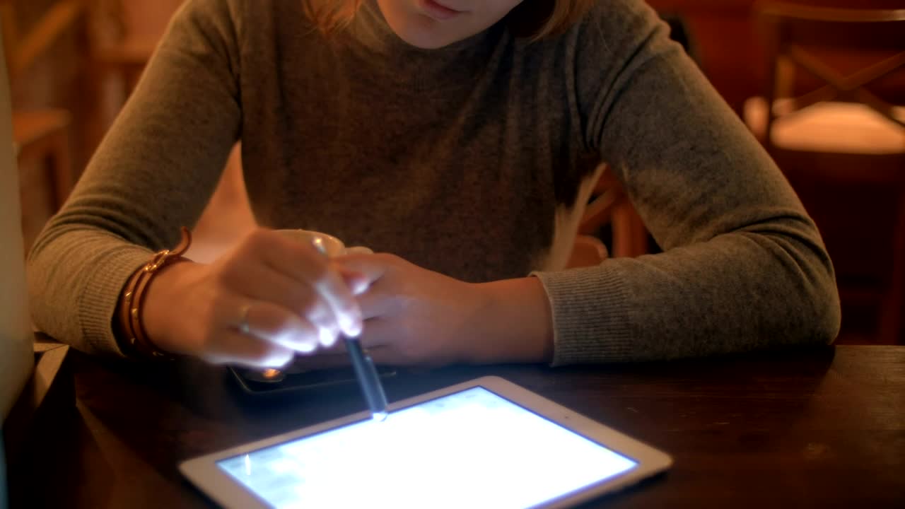 Stock Footage Woman Drinking Tea And Using A Tablet Live Wallpaper Free